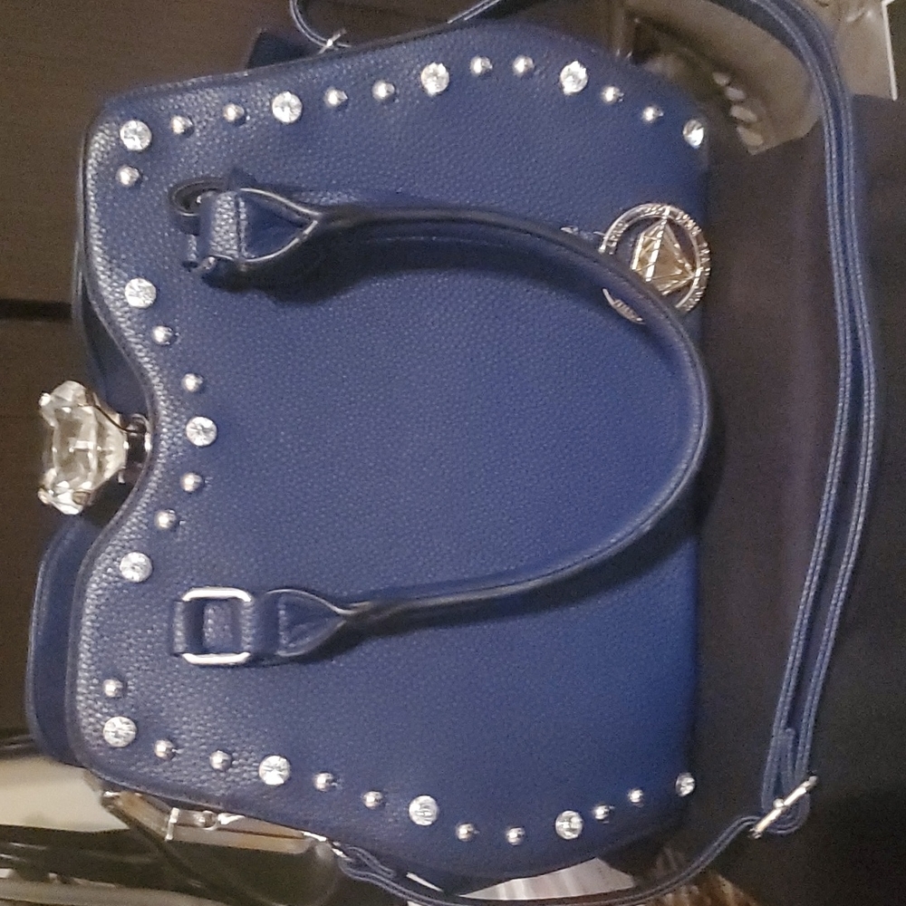 Traci Lynn blue purse. About 13"wide and 10"high. 3 sections